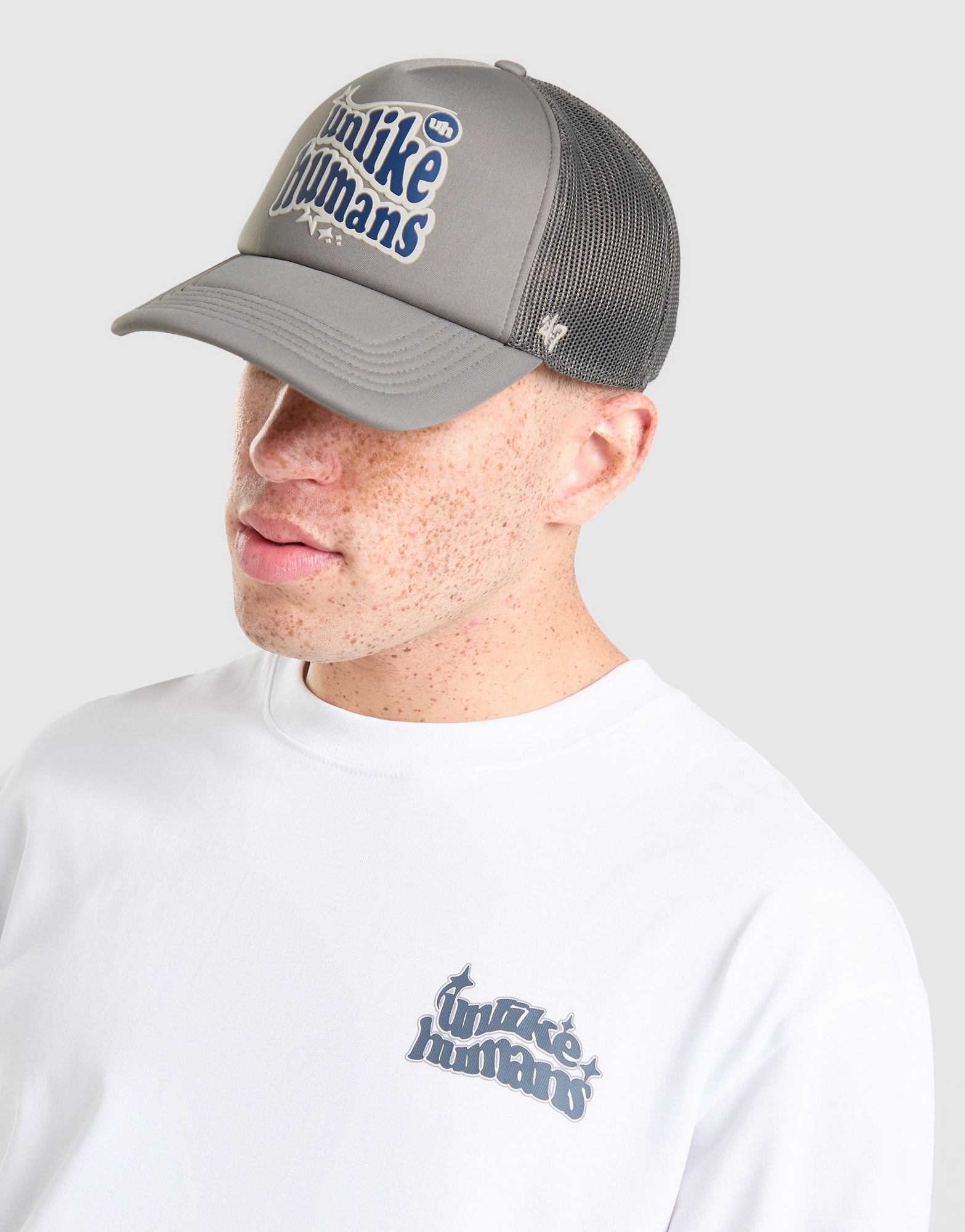 Unlike Humans Made Trucker Cap