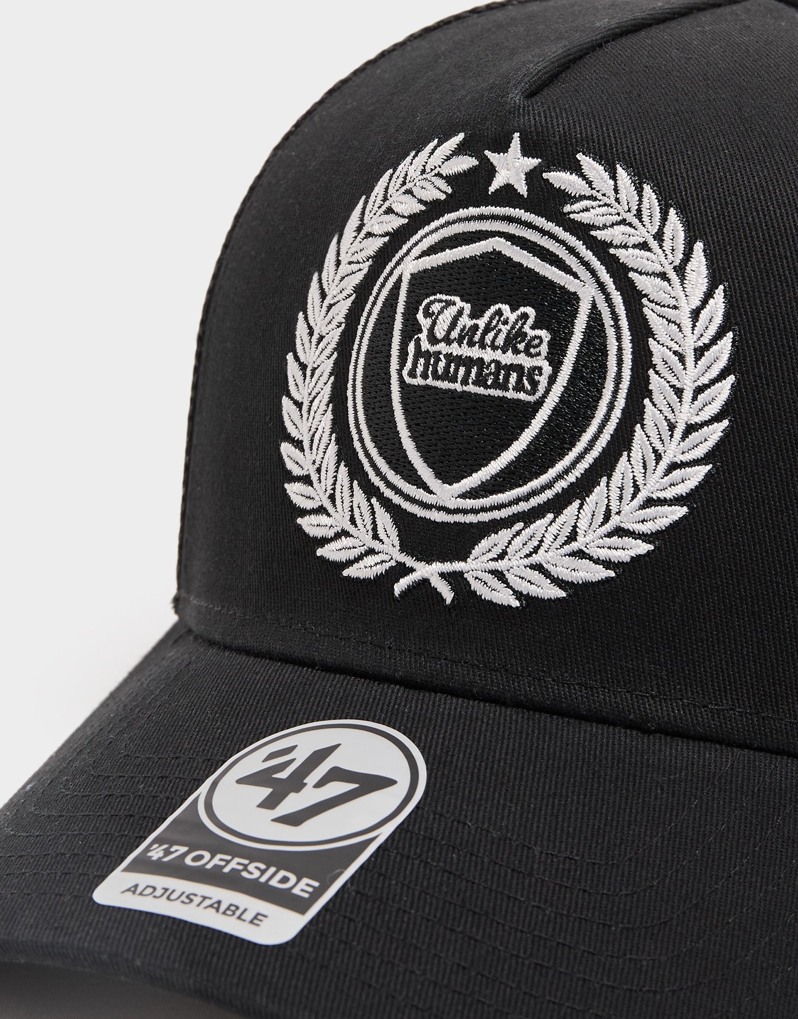 Unlike Humans Crest Trucker Cap
